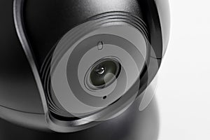 Close up of Black CCTV security camera on white background