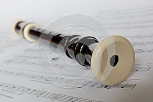Descant recorder on sheet music photo