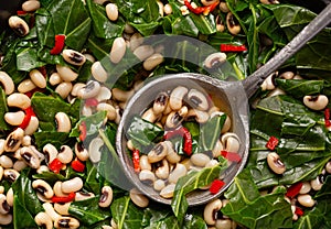 Close up of black-eye peas and collard greens