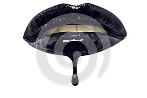 Close-up of black lip-gloss dripping from woman's lips over white background