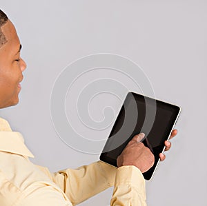 Close up of Black Man Hand Pointing to Tablet PC