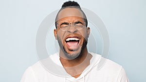 Close up of black man laugh with white toothy smile