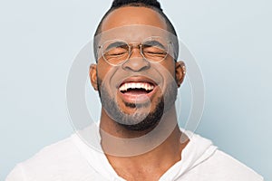 Close up of black man laugh with white toothy smile