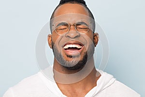 Close up of black man laugh with white toothy smile photo