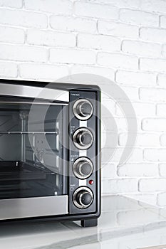 Close up of black mini electric oven home appliance