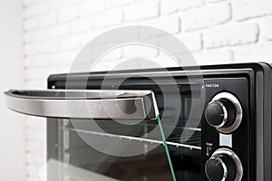 Close up of black mini electric oven home appliance