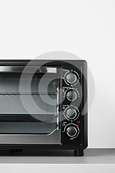 Close up of black mini electric oven home appliance