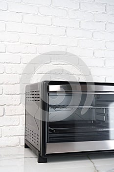 Close up of black mini electric oven home appliance