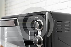 Close up of black mini electric oven home appliance