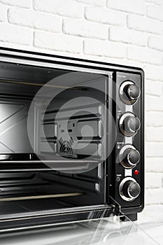 Close up of black mini electric oven home appliance