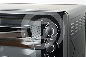 Close up of black mini electric oven home appliance