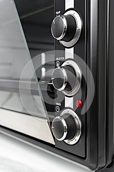 Close up of black mini electric oven home appliance