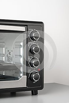 Close up of black mini electric oven home appliance