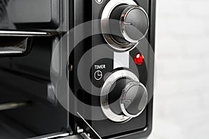 Close up of black mini electric oven home appliance