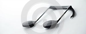 Close up of a black musical note against a bright white background , texture, notation