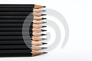 Close-up of a black pencil on a white background