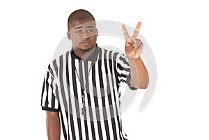 Close up of black referee calling a two shot foul photo