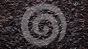 Close-up of black rice grains scattered on white background, top view. Black rice texture. Suitable for food and