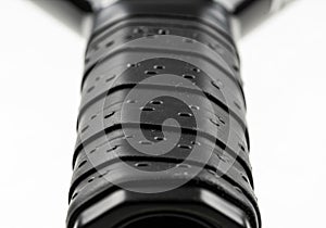 The background is blurred, drawing focus to the detailed texture of the handle