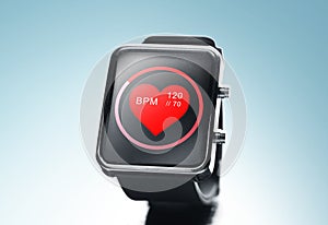Close up of black smart watch with heart beat icon