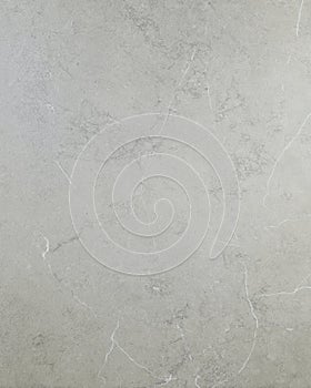 Black soapstone slab with light veining and matte honed texture in close-up photo