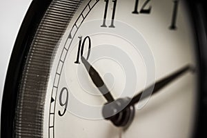 A close up of black and whit clock.