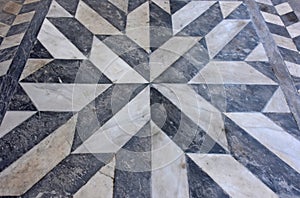 Geometric black and white marble floor with star-shaped pattern