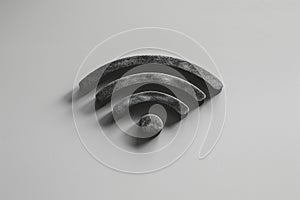Close up of black Wi-Fi symbol on a gray background, emphasizing wireless connectivity, internet access, and modern photo