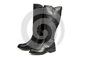 Close-up of black women\'s leather knee-high boots isolation on white background.