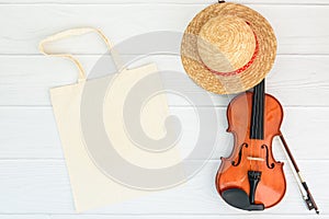 Close up blank template tote bag with violin. Summer Holiday concept