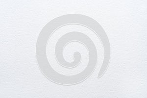 Close-up of blank textured white paper surface with subtle patterns and soft