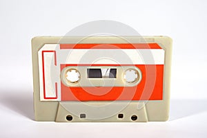 Close up of a blank vintage audio tape cassette isolated on white