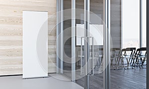 Close up of blank white roll up in modern office with wooden walls, 3d rendering