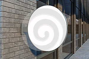 Close up of blank white urban round stopper on brick building exterior. Pub or restaurant concept. Mock up