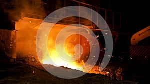 Close up for blast furnace and hot molten steel being poured into the chute, heavy industry concept. Stock footage