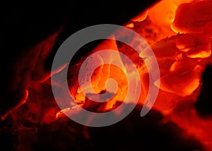 A macro of red hot coals photo