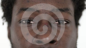 Close up of Blinking Eyes of Casual African Man