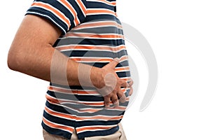 Close-up of bloated man touching painful stomach with copyspace