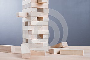Close up blocks wood game on wooden table background.