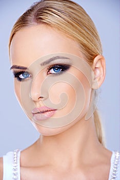 Close up Blond Woman with Blue Eyes