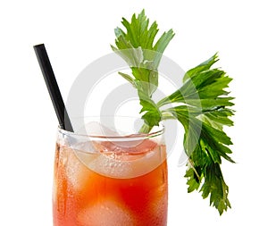 Close-up of bloody mary with ice cubes with celery on white
