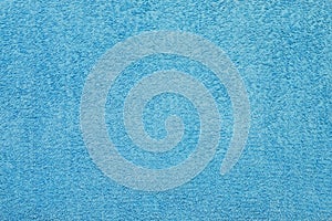Close up of a blue bath towel, towel texture.