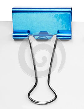 Close up of a blue binder clip