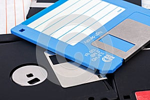 Close-up of a blue and black 3.5-inch computer floppy disk as a background