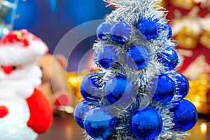 Close-up of blue christmas tree, and Christmas holiday background concept with toys, decorations