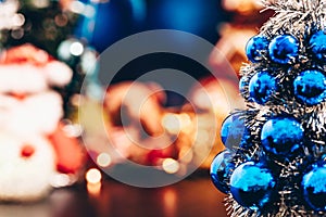 Close-up of blue christmas tree, and Christmas holiday background concept with toys, decorations, ornaments