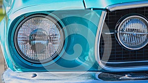 Close Up Of Blue Classic Car Headlight