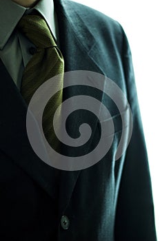 Close-up of a blue coat with striped tie. Conceptual image shot