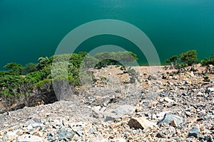Close-up of a blue dam lake among green mountains in GÃ¶kceada,