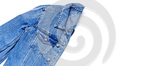 Close-up Blue denim jacket on isolated white background top view flat lay copy space. Denim, fashionable jacket, women`s or men`